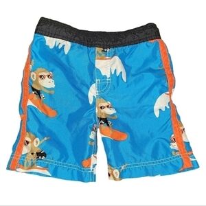 Toddler boys size 3T swimming trunks. Monkey riding surfboard graphic